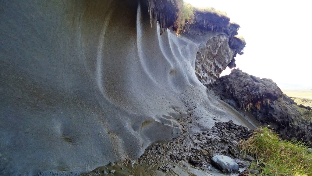 Permafrost thaw causing an altered landscape and the release of carbon and mercury among other environmental elements.